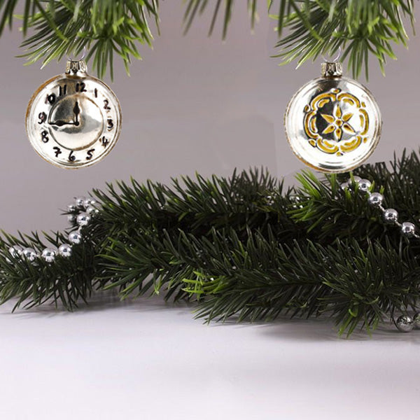 Pocket Watch Ornament from front and back hanging on a Christmas tree