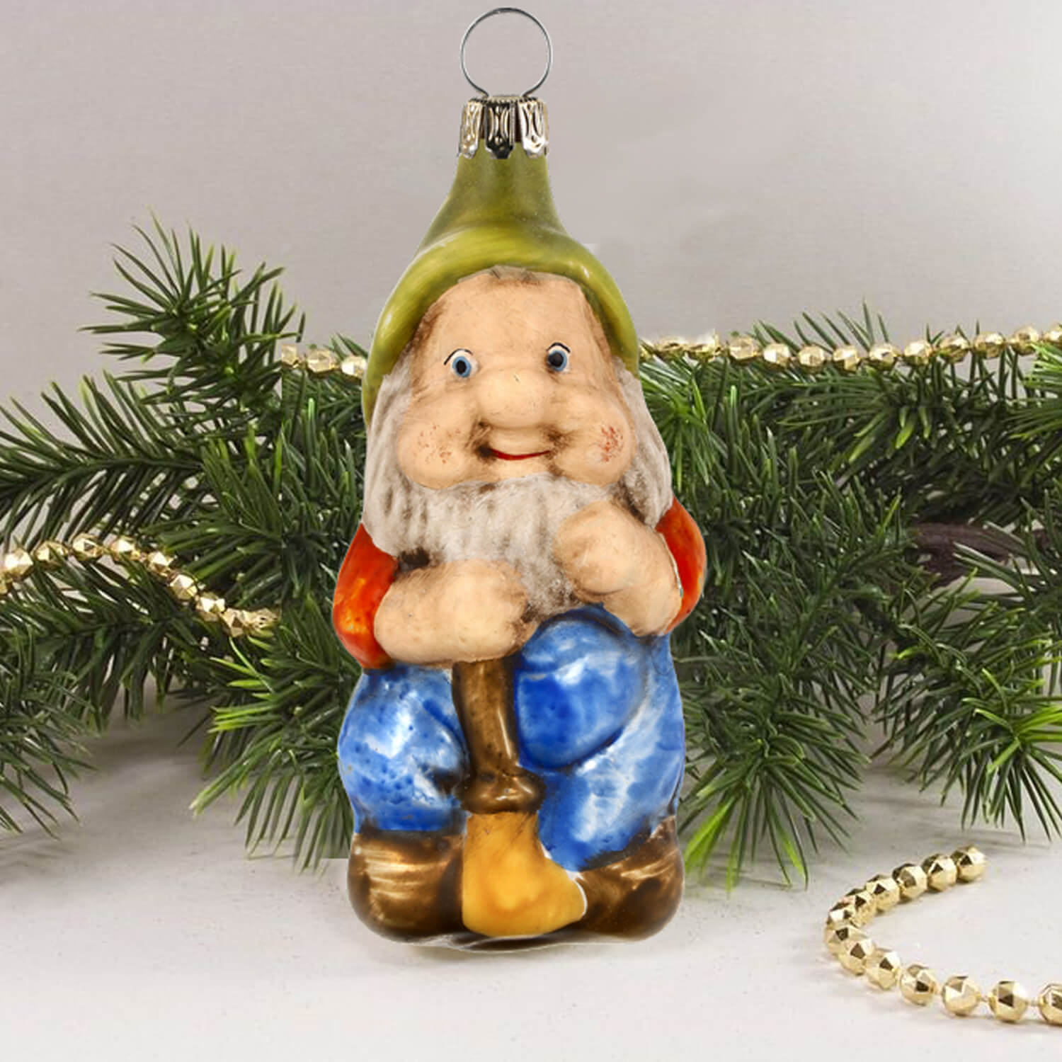 MAROLIN® - Glass ornament "Dwarf with broom" in front of Christmas tree