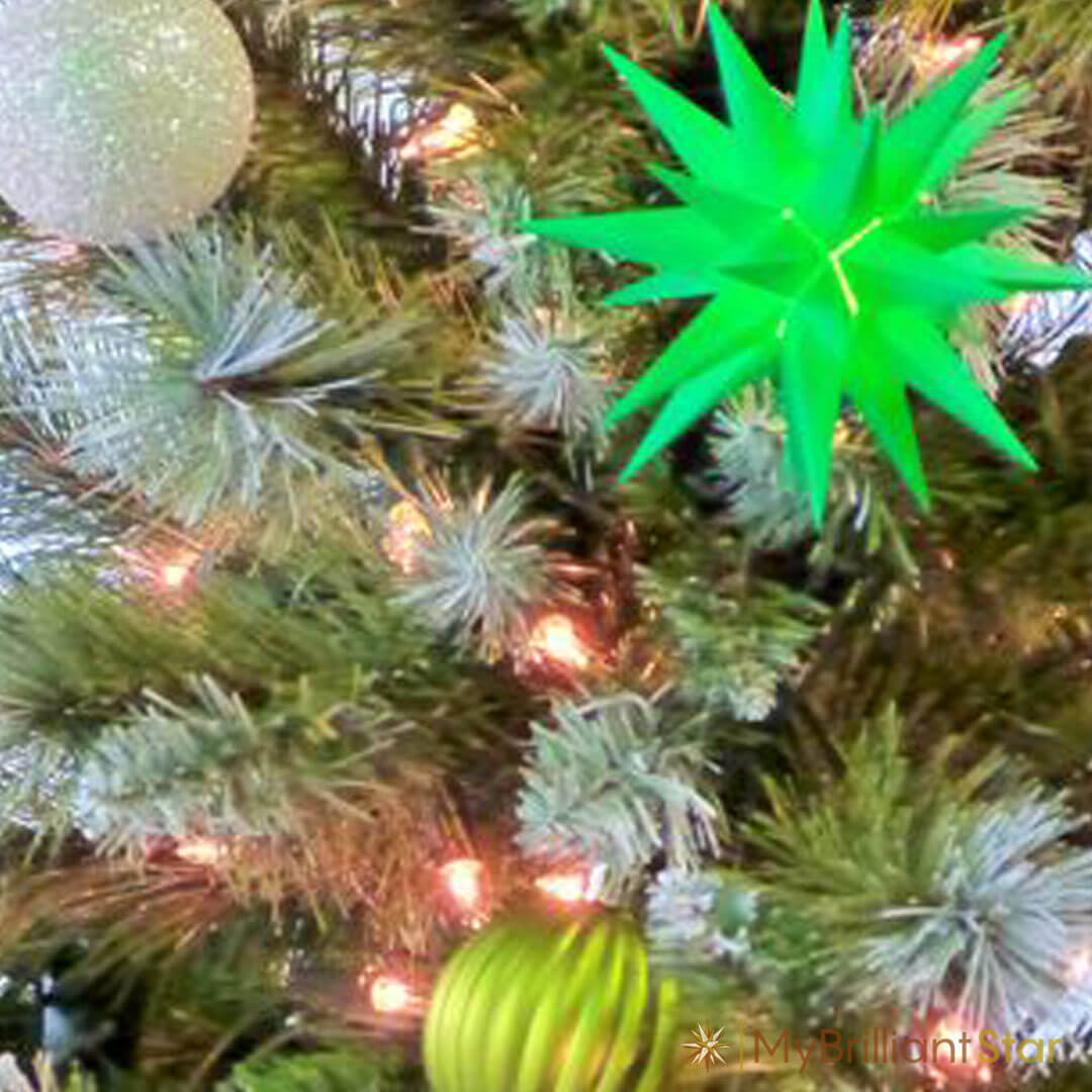 Christmas tree decorated with green Original Herrnhut plastic star, ~ 13 cm / 5 inch ø