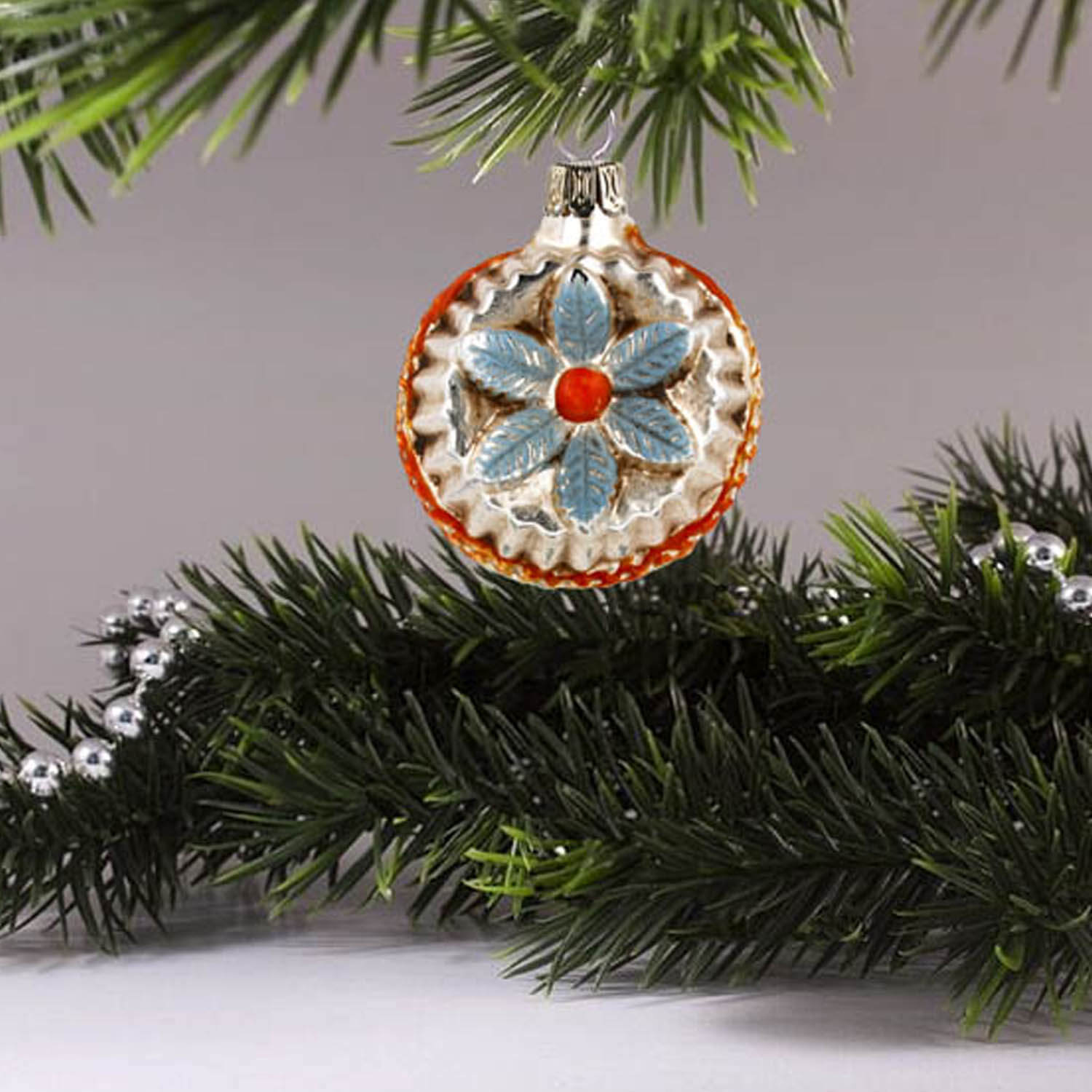 MAROLIN® - Miniature glass ornament "Bloom with jags blue" hanging on Christmas tree