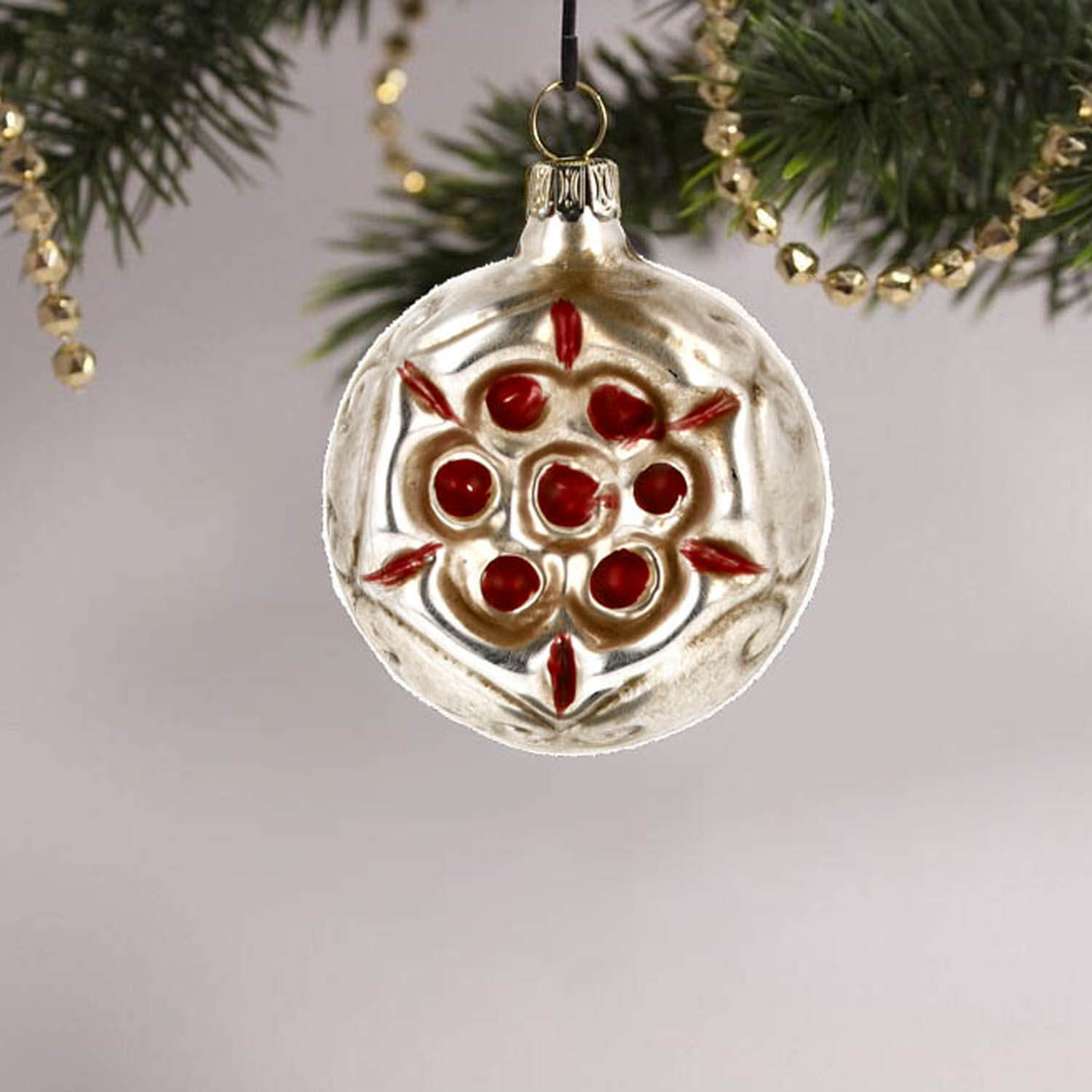 MAROLIN® - Glass ornament "Red Flower" hanging on decorated Christmas tree