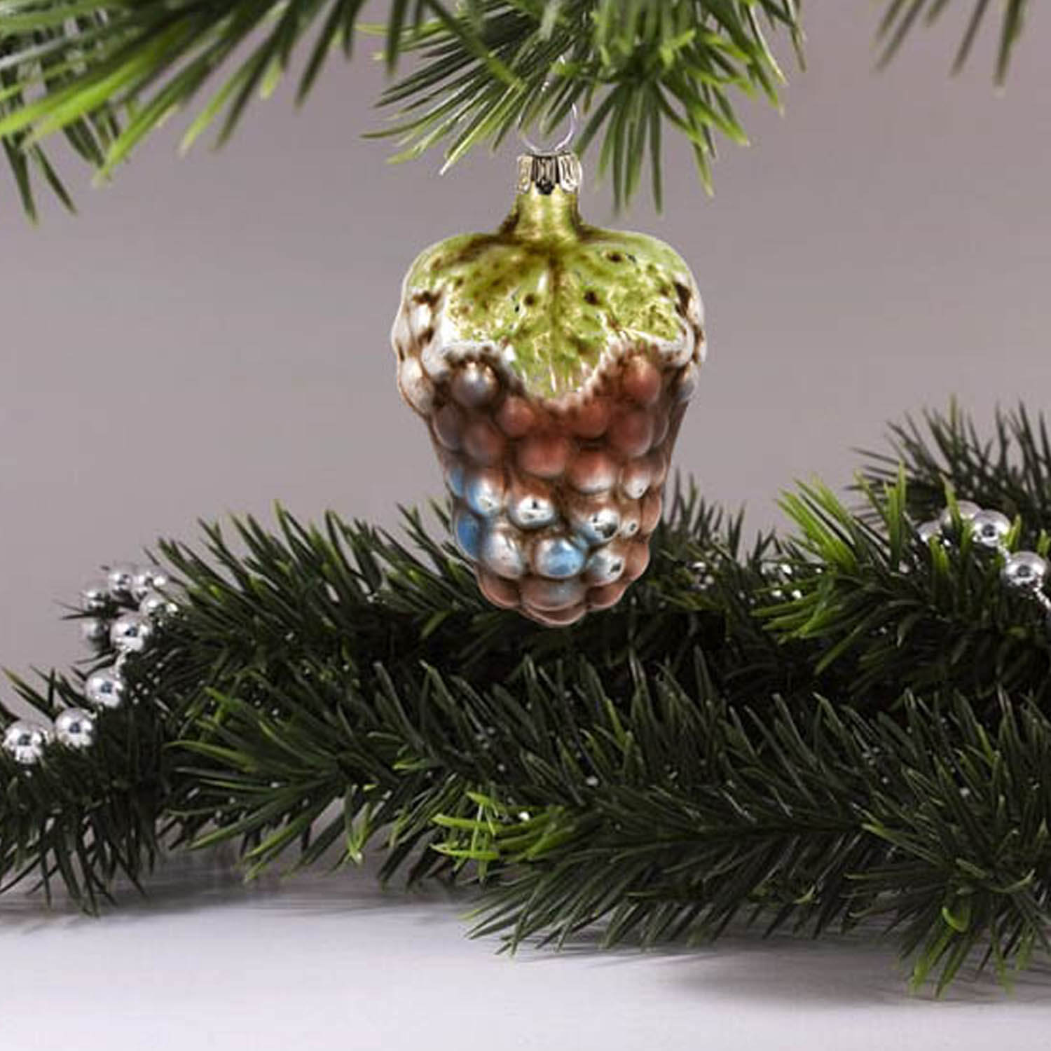 MAROLIN® - Glass ornament "Small grape with leaf" hanging on a tree