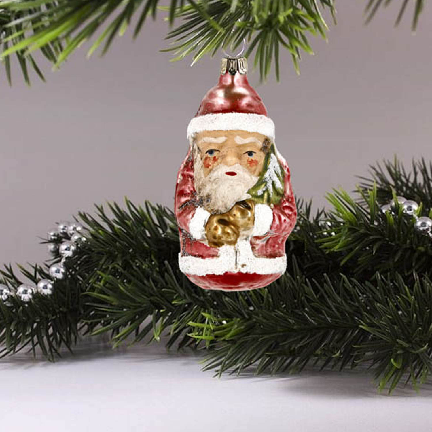 MAROLIN® - Glass ornament "Little Santa" hanging on Christmas tree