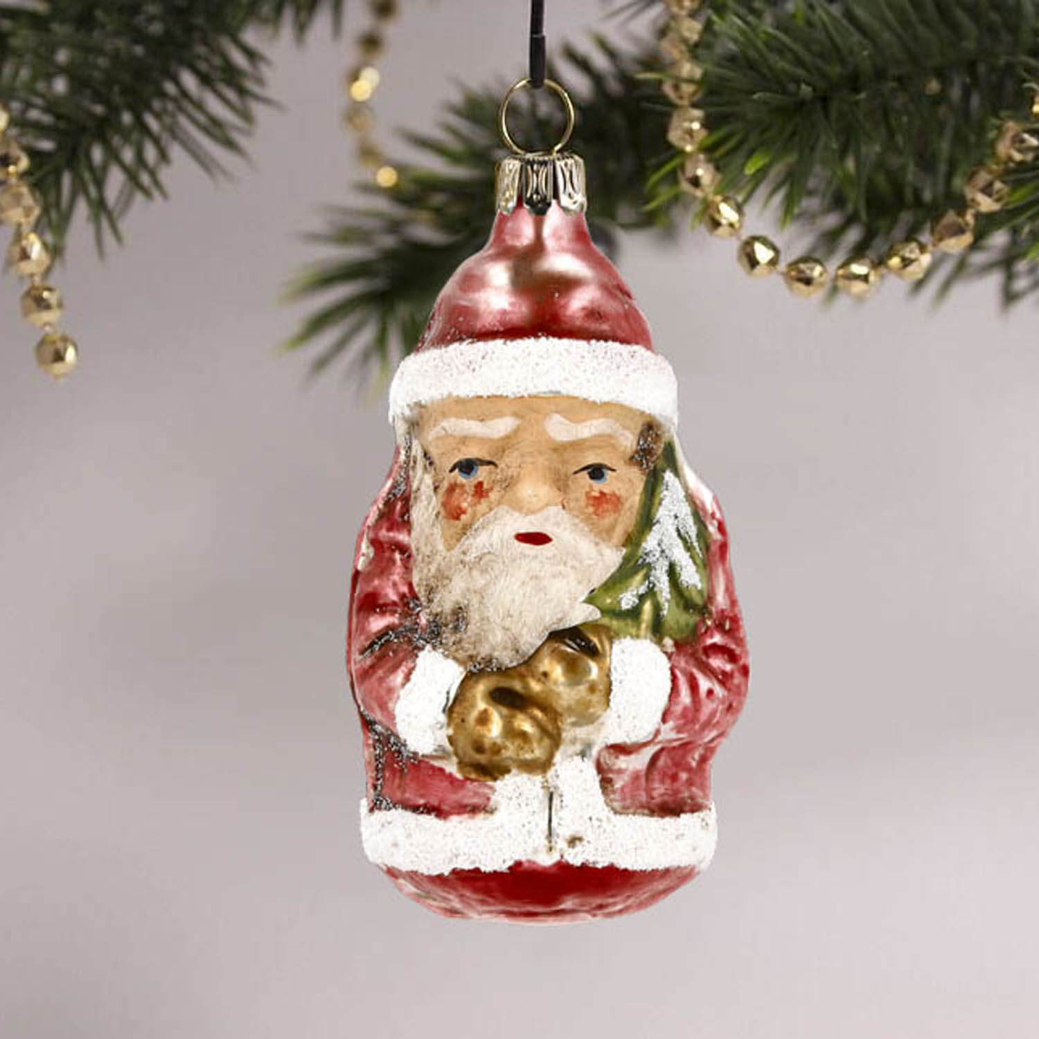 MAROLIN® - Glass ornament "Little Santa" hanging on decorated tree
