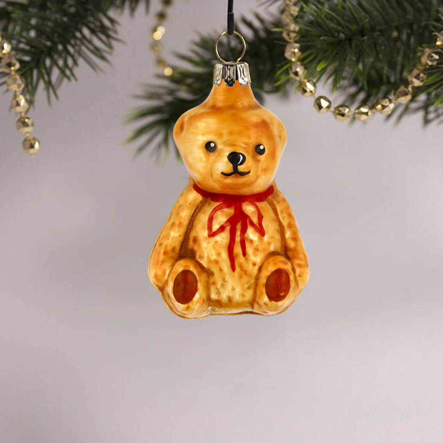 MAROLIN® - Glass ornament "Little Teddy bear sitting" on Christmas tree