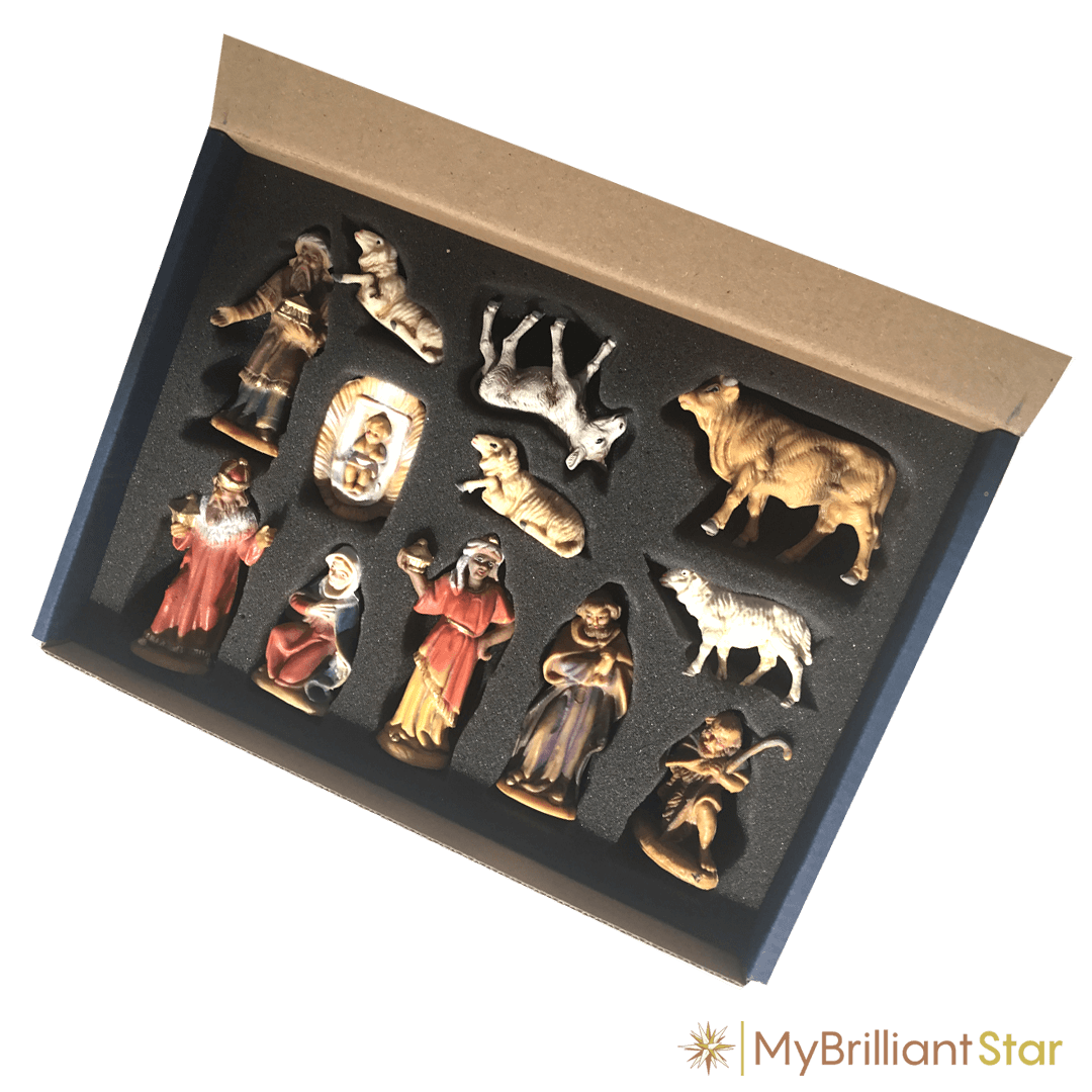 12 Nativity scene figures packed in a blue box.