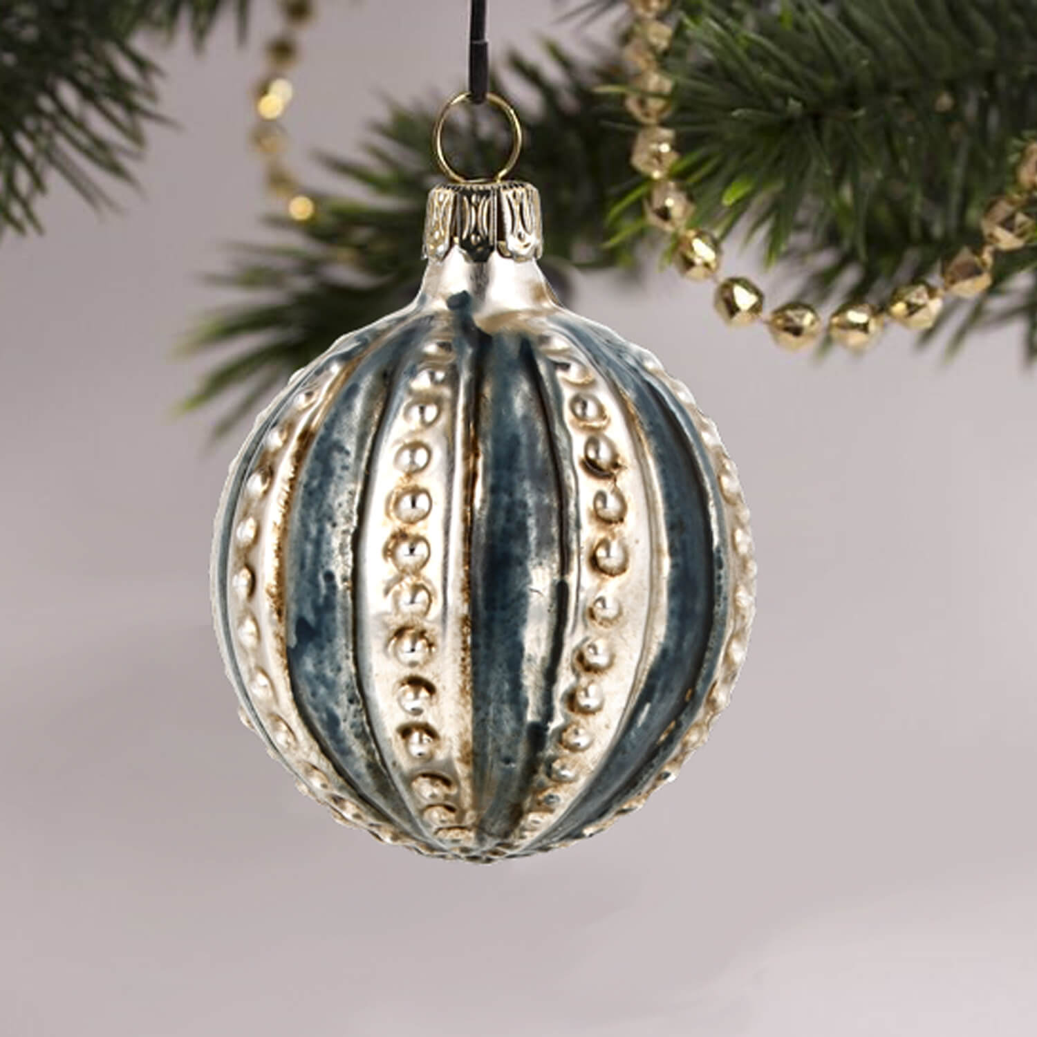 MAROLIN® - Glass ornament "Ball with blue Stripes" hanging on Christmas tree