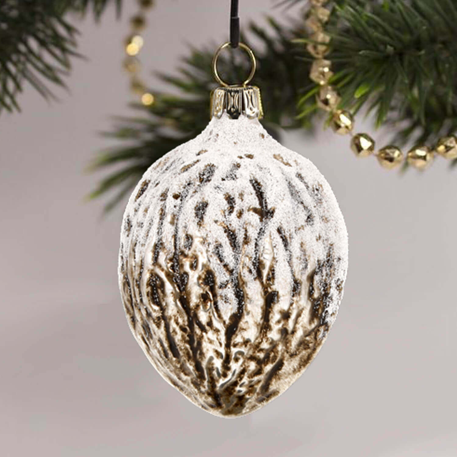 MAROLIN® - Glass ornament "Glittered Walnut" hanging on Christmas tree