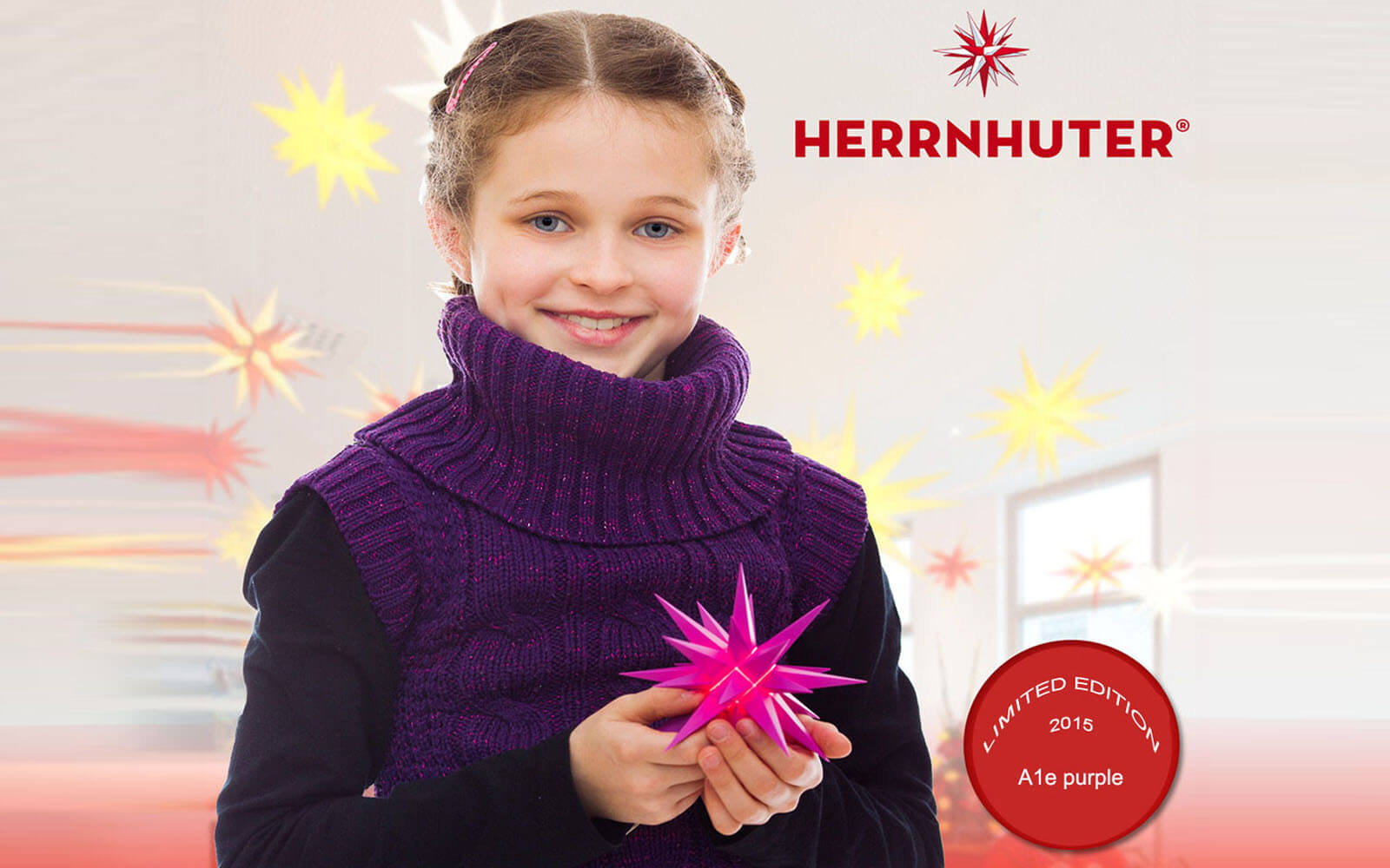 Child holding the Herrnhut Special Edition 2015 - purple