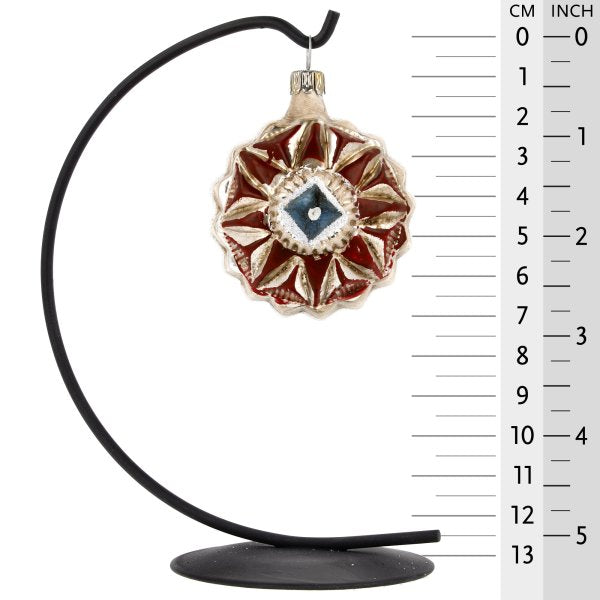 Handblown glass ornament featuring an American kaleidoscope design with vibrant colors and intricate details.