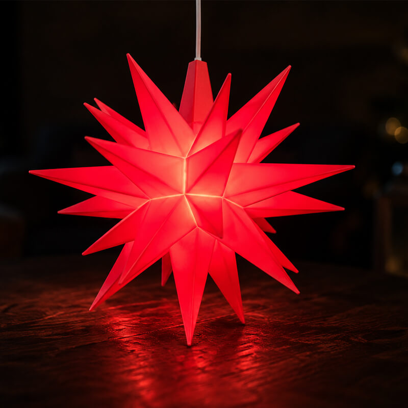 Herrnhut Ministar lit up red on wooden table