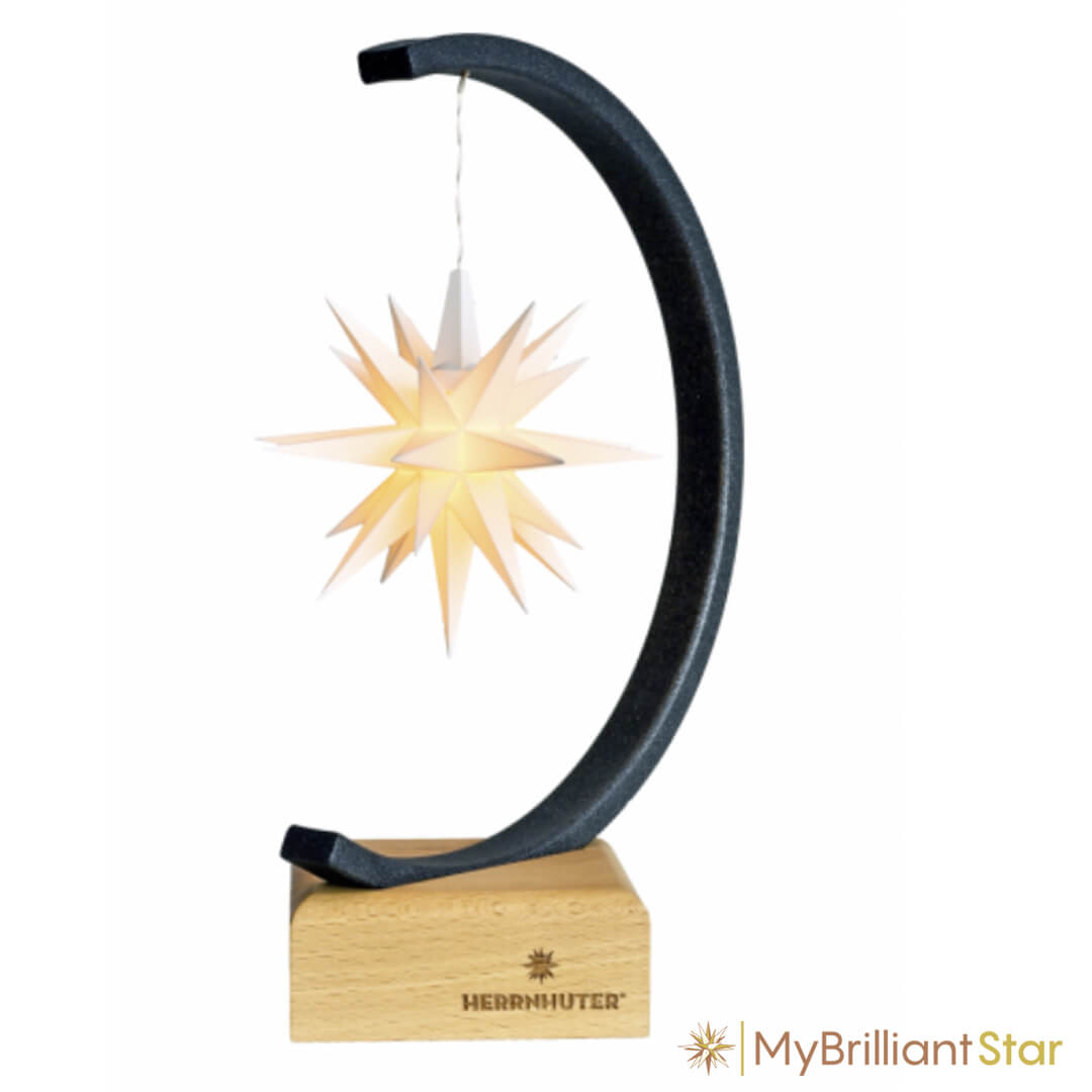 White Herrnhut star shining on starbow