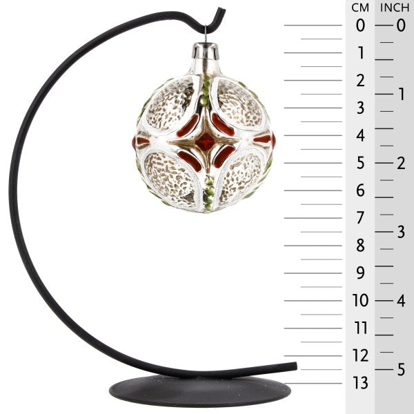 Decorative glass ornament with intricate details, showcasing a cross design perfect for Christmas celebrations.