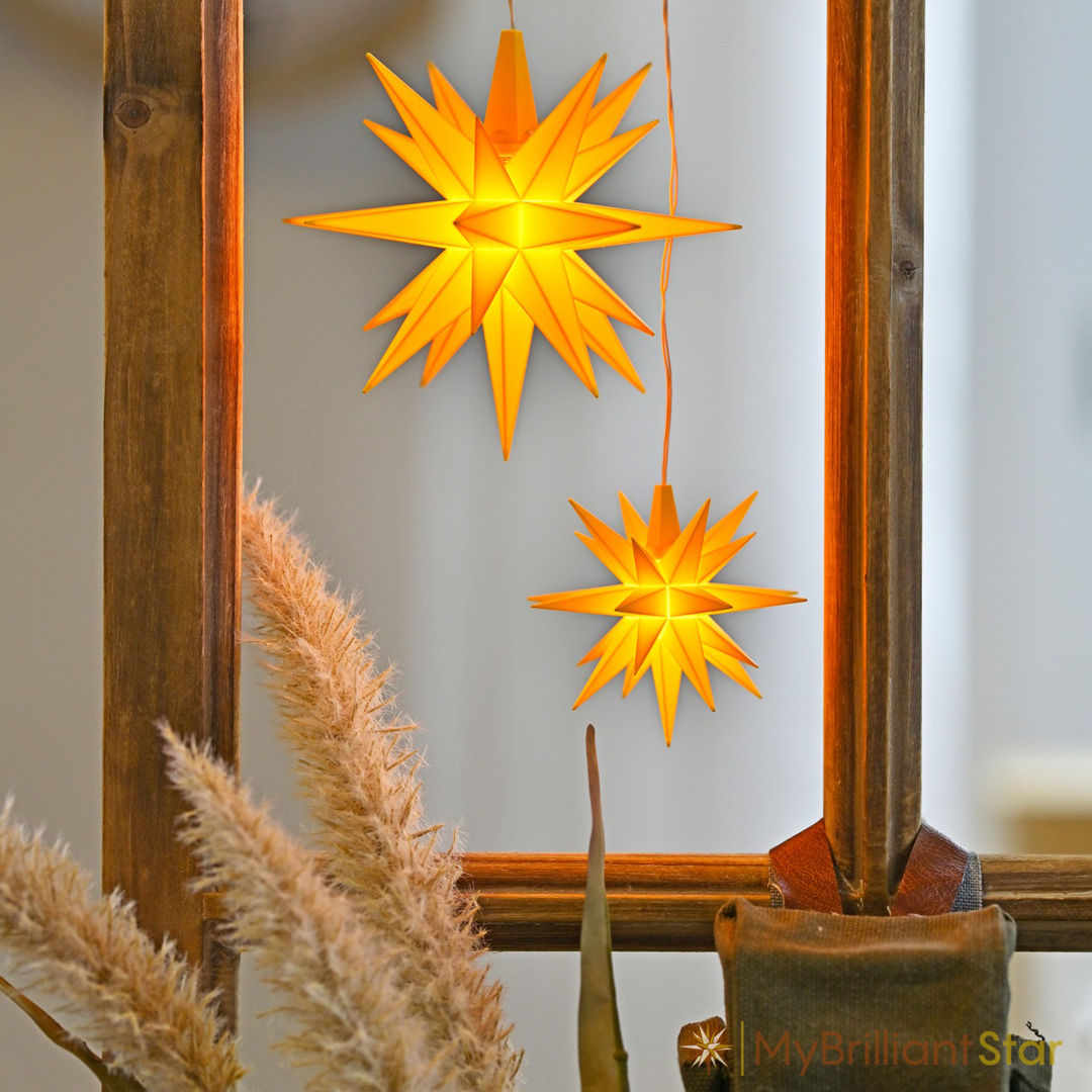 Window decorated with Original Herrnhut plastic MINISTAR, yellow, ~ 8 cm / 3 inch ø - LED