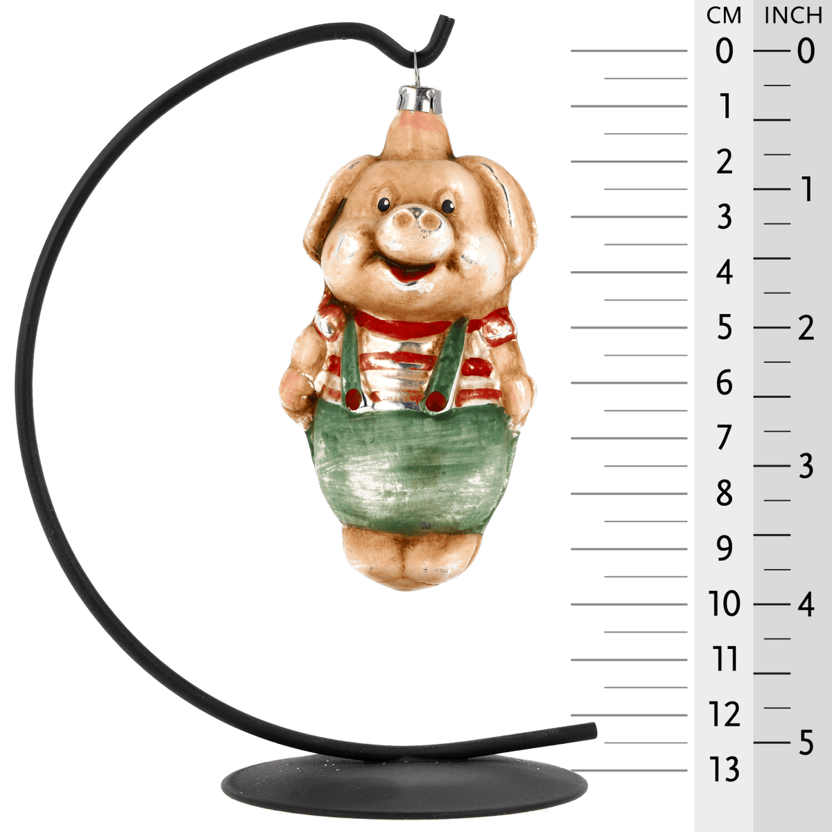 MAROLIN® - Glass ornament &quot;Pig with pants&quot; displayed on a 13 inch Herrnhut Star bow