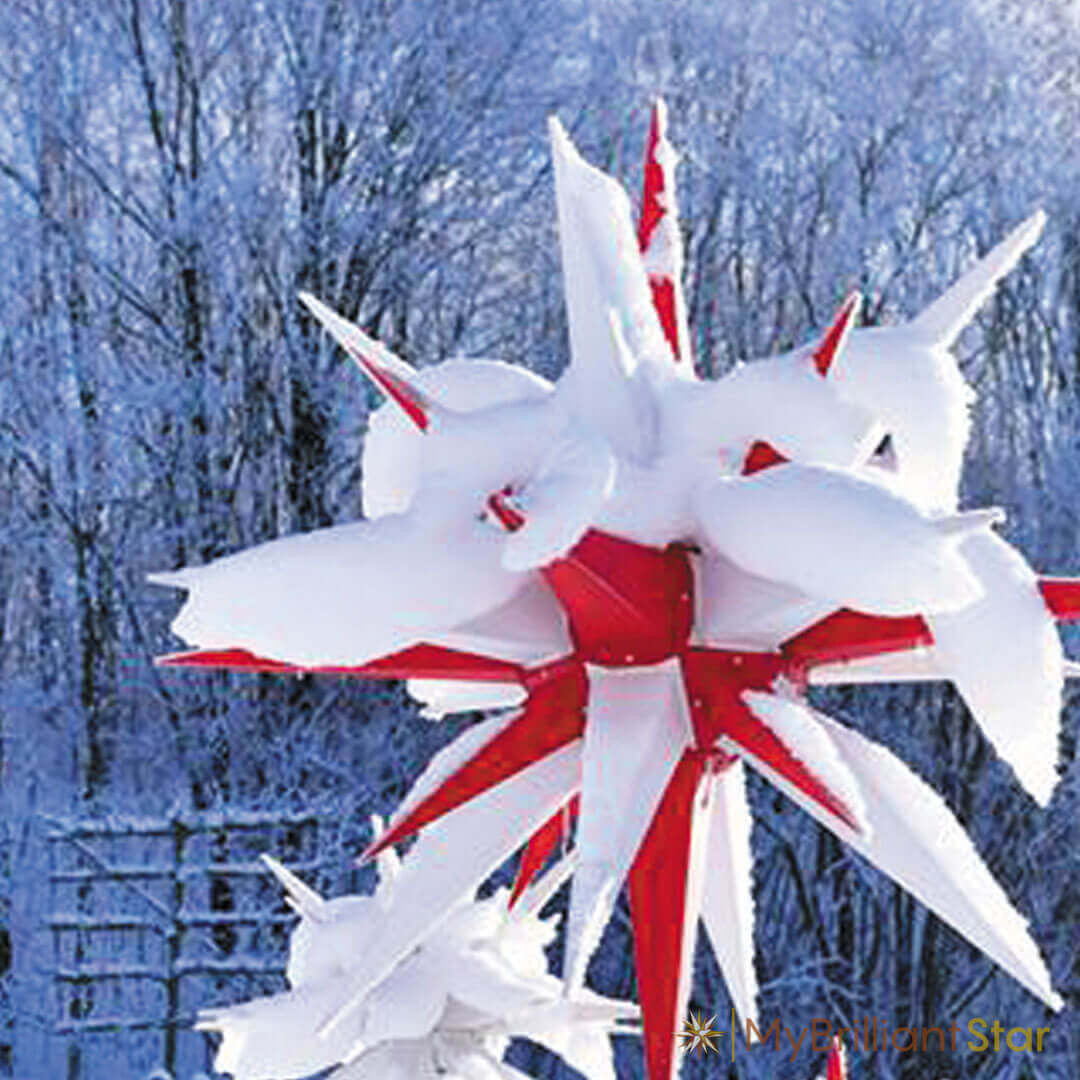 Original Herrnhut plastic star, white / red, ~ 130 cm / 51 inch ø covered in snow