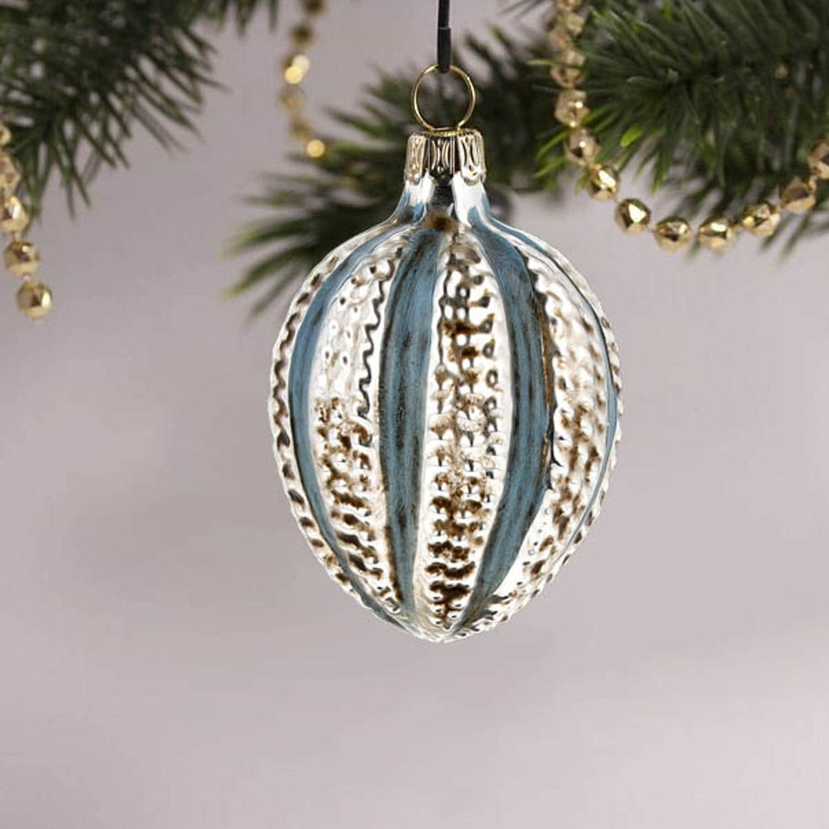 MAROLIN® - Miniature glass ornament &quot;Egg with knobs blue&quot; on decorated Christmas tree