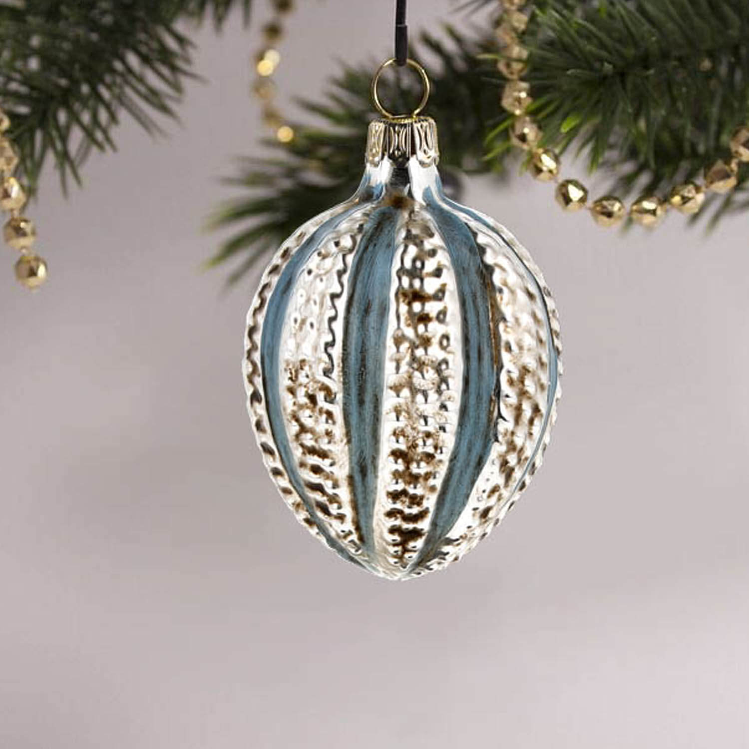 MAROLIN® - Miniature glass ornament "Egg with knobs blue" on decorated Christmas tree