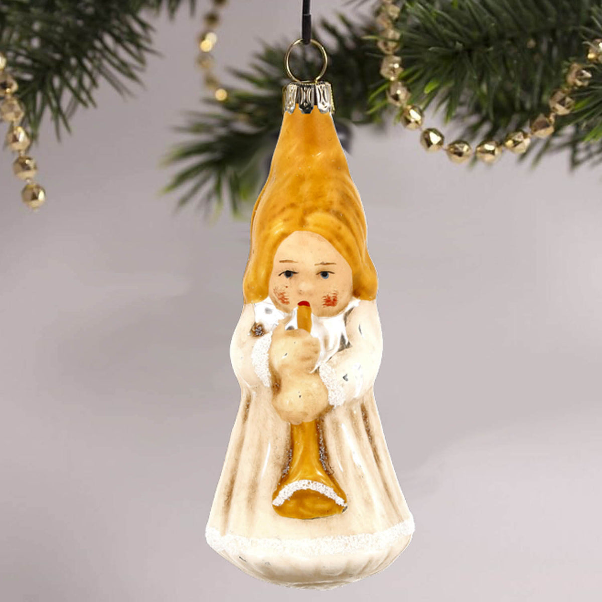 MAROLIN® - Glass ornament &quot;Trumpeting angel&quot; hanging on decorated Christmas tree