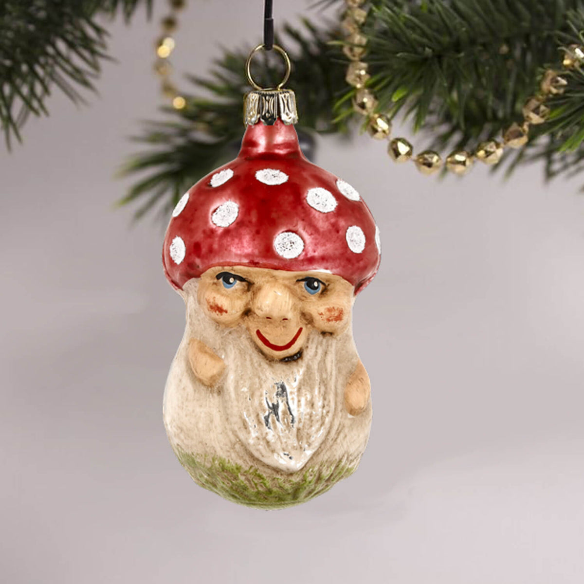MAROLIN® - Glass ornament &quot;Mushroom with face&quot; hanging on a with gold chain decorated Christmas tree