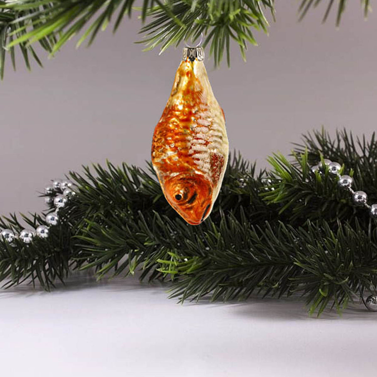 MAROLIN® - Miniature glass ornament &quot;Fish orange&quot; hanging on a Christmas tree