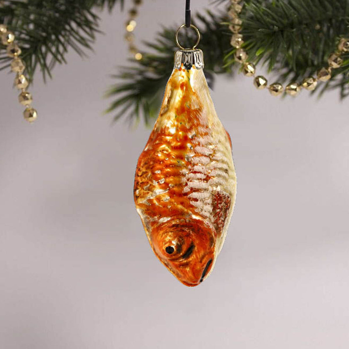 MAROLIN® - Miniature glass ornament &quot;Fish orange&quot; hanging on a decorated Christmas tree