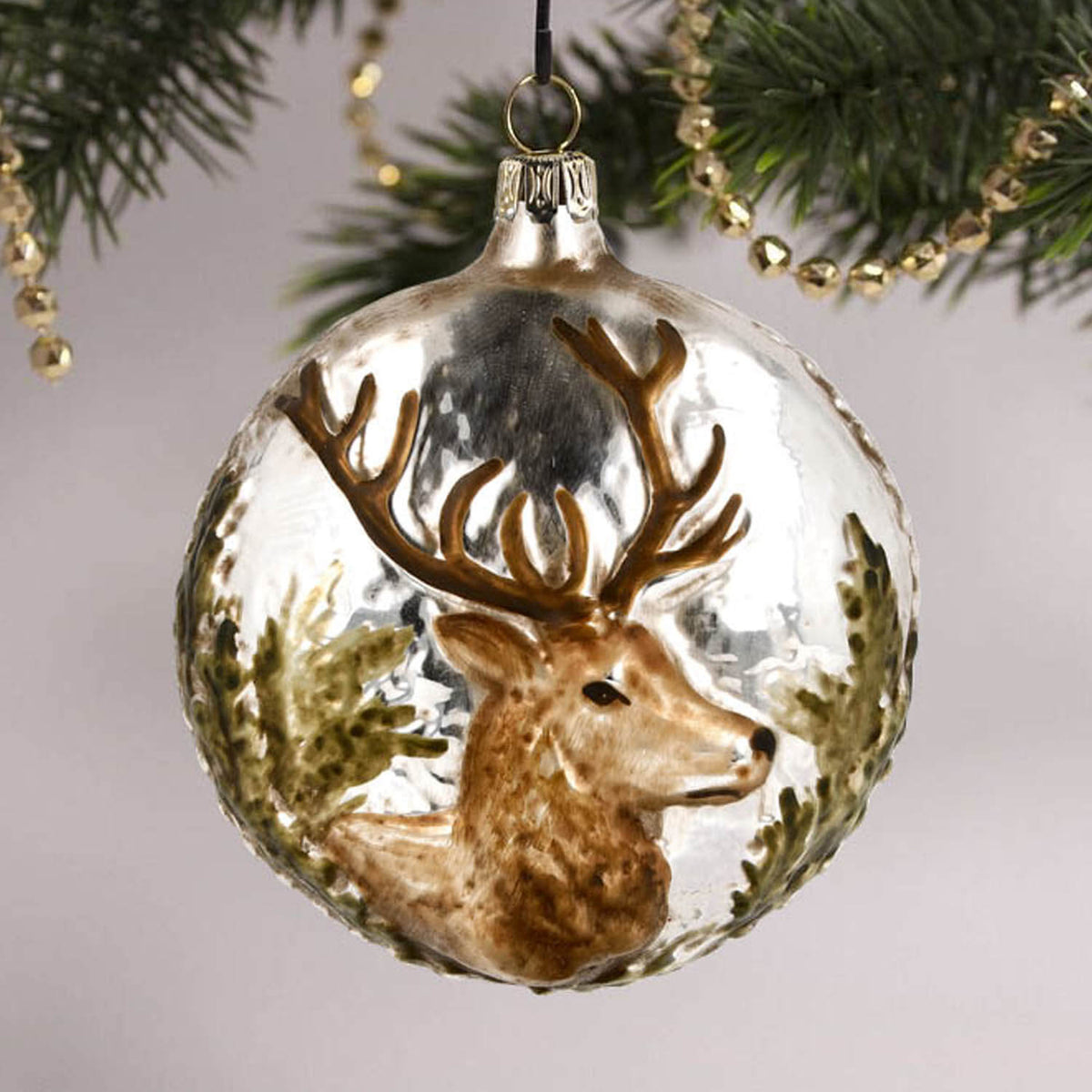 MAROLIN® - Glass ornament &quot;Stag&quot; haging in a decorated Christmas tree