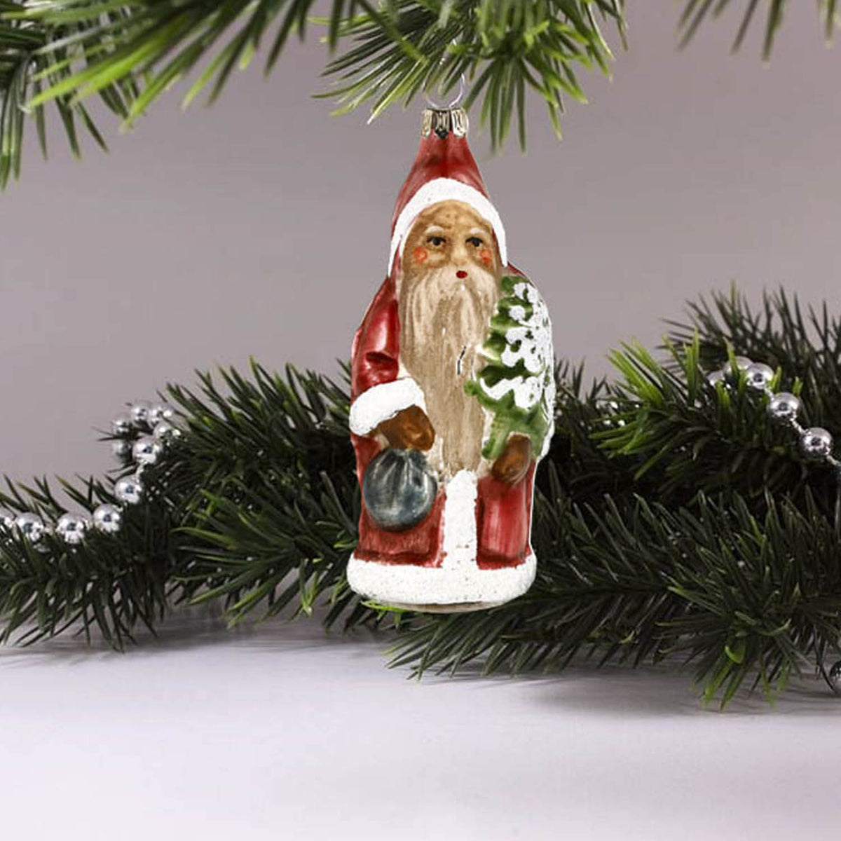MAROLIN® - Glass ornament &quot;Little Santa with backpack and tree&quot; hanging up as Christmas decoration