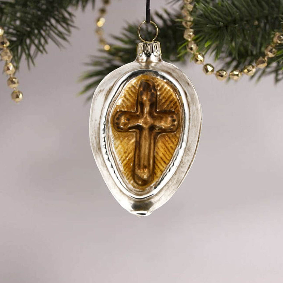 MAROLIN® - Glass ornament &quot;Cross with roses&quot; hanging in a decorated Christmas tree