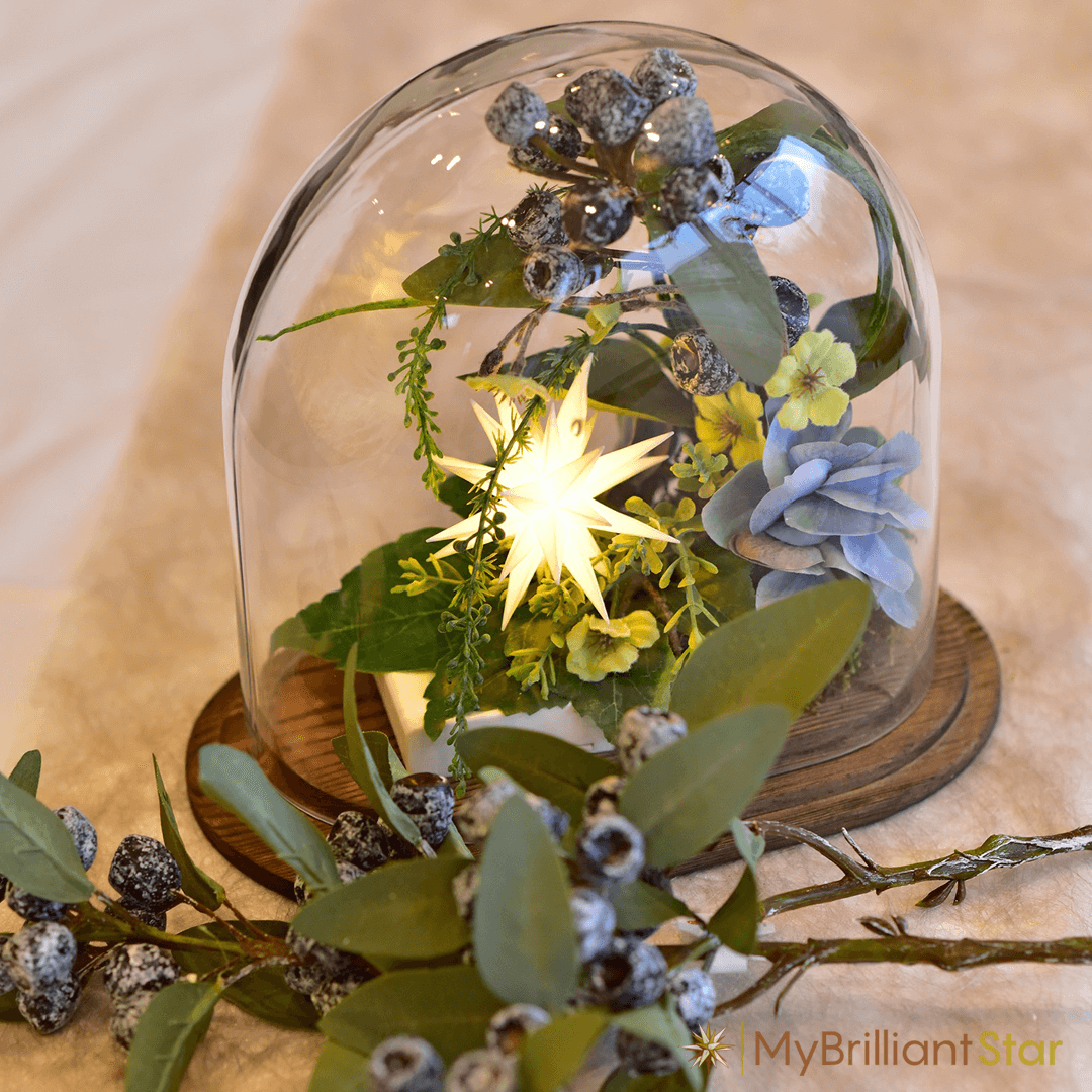 a beautiful flower decorated with the Original Herrnhut plastic MINISTAR, white, ~ 8 cm / 3 inch ø - LED bulb