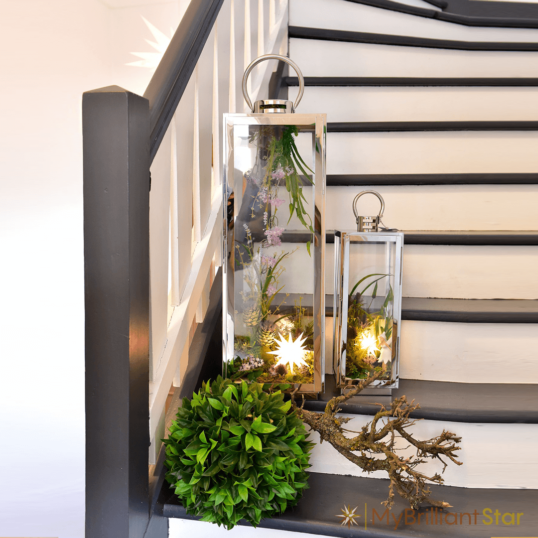 a stair case decorated with Original Herrnhut plastic MINISTAR, white, ~ 8 cm / 3 inch ø - LED bulb