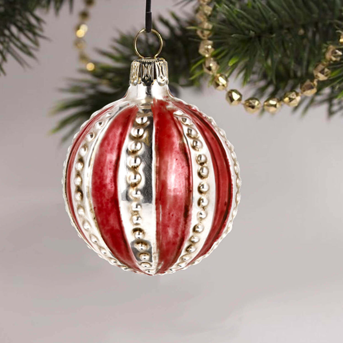 MAROLIN® - Glass ornament &quot;Ball with red Stripes&quot; hanging on a Christmas tree