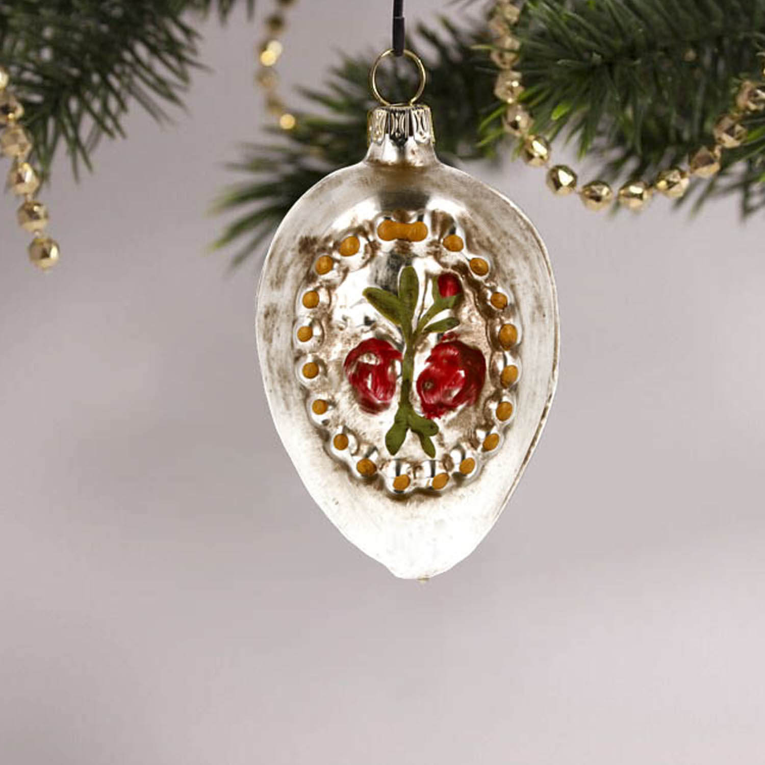 MAROLIN® - Glass ornament "Cross with roses" from back in Christmas tree