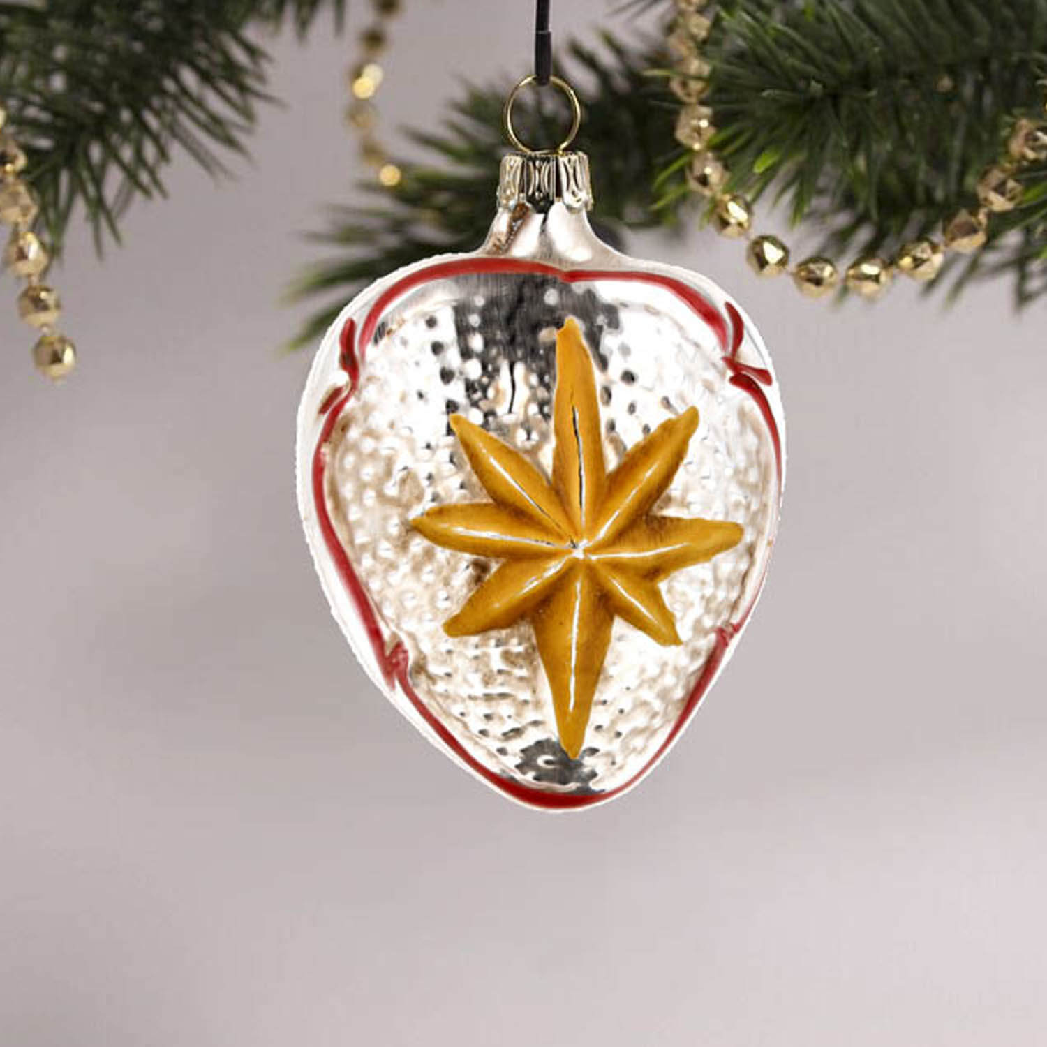 MAROLIN® - Glass ornament "Heart with snowdrop"  hanging on decorated Christmas tree