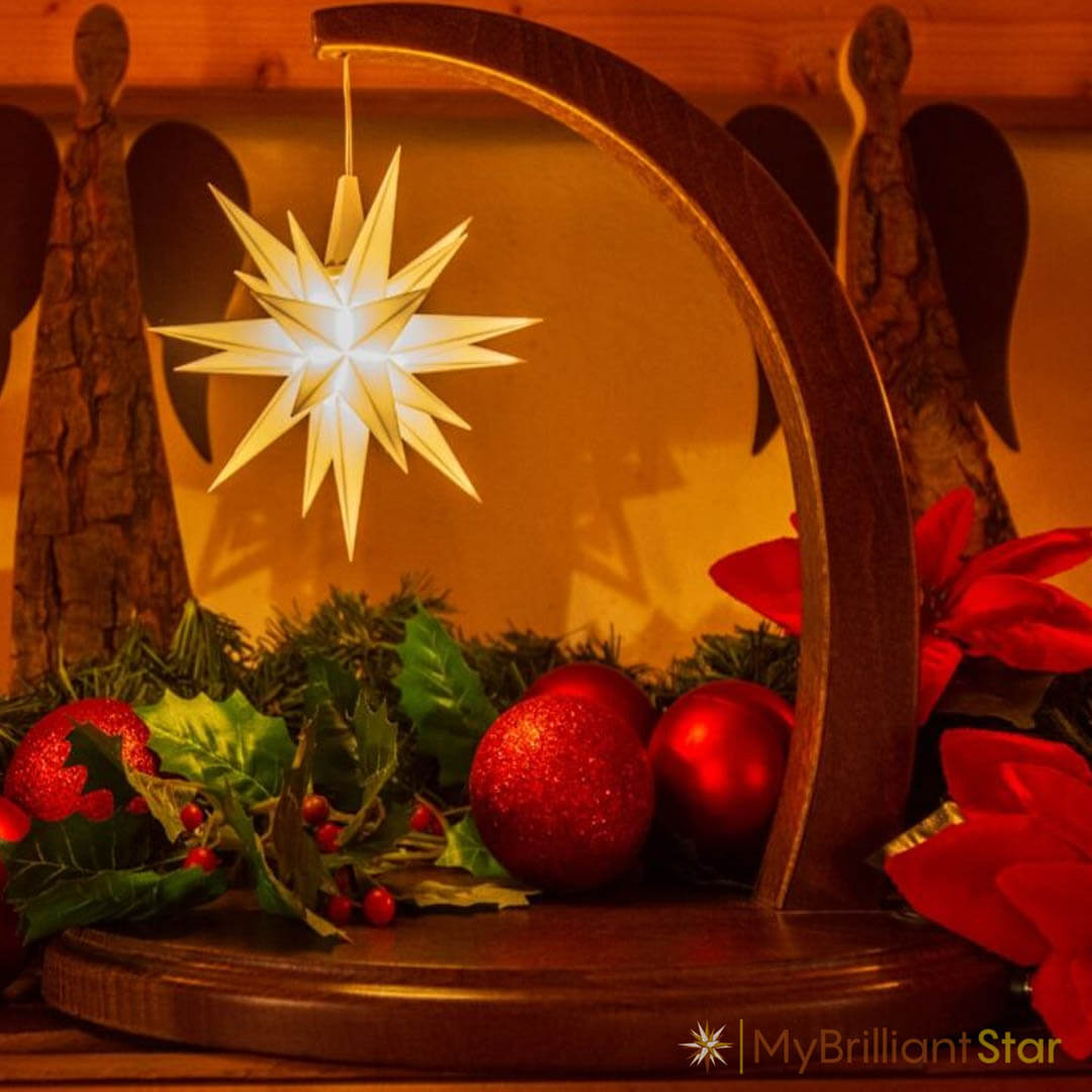 Walnut stained wooden Starbow with warm lightning plastic star