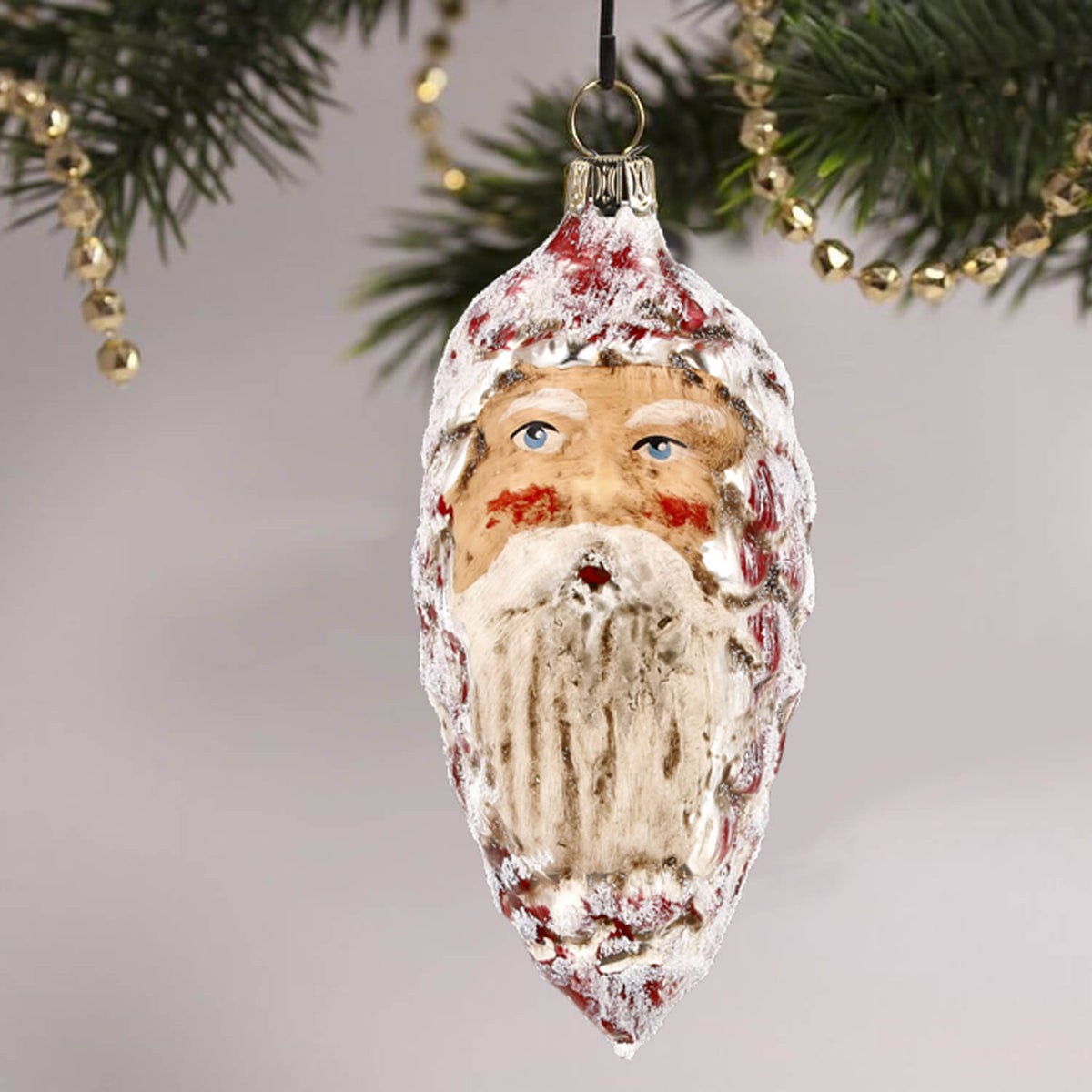 MAROLIN® - Glass ornament &quot;Red pinecone&quot; hanging on golden decorated Christmas tree