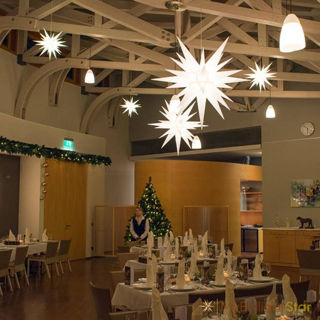 Original Herrnhut paper star, white, ~ 70 cm / 27 inch ø hanging in dining room